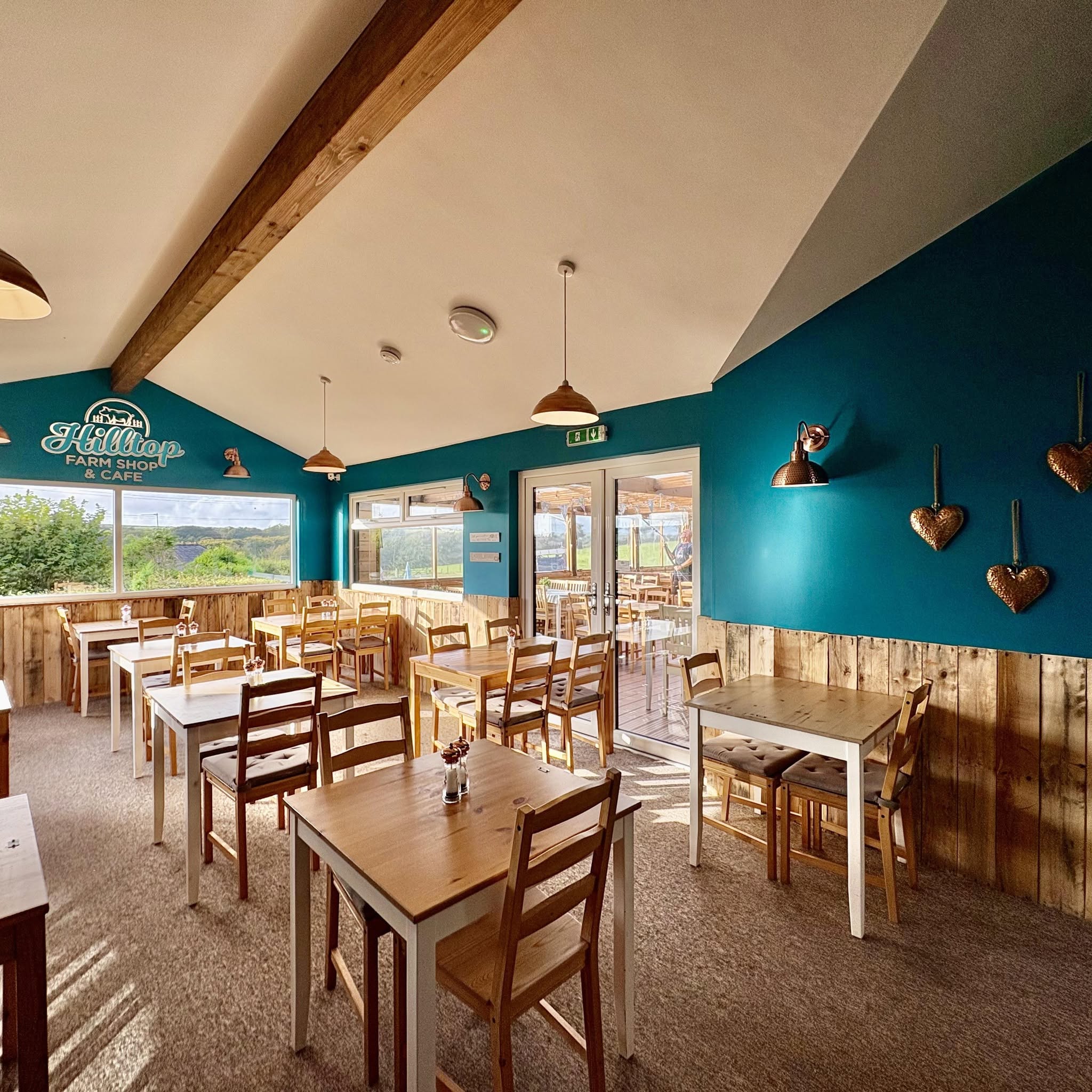 The bright and welcoming café dining room at Hilltop Farm Shop